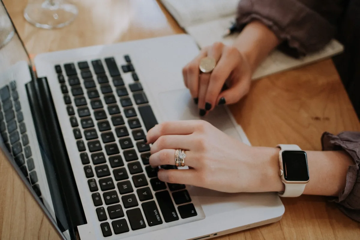 Working at a laptop on an email campaign